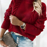 
A red chunky turtleneck sweater designed for women, featuring a cozy fit ideal for fall and winter fashion. The sweater is displayed on a mannequin, showcasing its soft texture and stylish design.