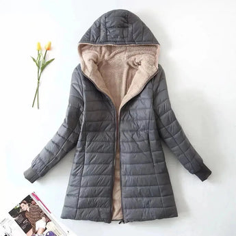 Alt text: A Women's gray fleece-lined hooded winter coat in size 3XL, designed as an insulated parka with a focus on warmth and comfort. The coat features a full-length design with a hood, long sleeves, and a high collar for added protection against cold weather.