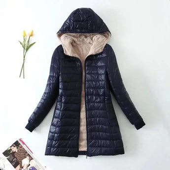 Dark blue women's fleece-lined hooded winter coat with a fur-trimmed collar, insulated for warmth, featuring long sleeves and a stylish design.