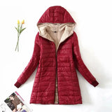 Women's red fleece-lined hooded winter coat in a 3XL size, featuring a cozy collar and long sleeves, designed as an insulated parka for warmth.