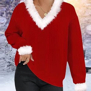 
A woman wearing a red fuzzy V-neck sweater featuring a white fur trim, with emphasis on the outerwear's stylish fashion design, sleeve details, and textile texture, while standing with her waist slightly turned.