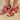 Women's red leather chunky heel strappy sandals with gold buckles, featuring a bold red color, open toe design, and elegant high heels, showcasing a fashionable and stylish appearance.