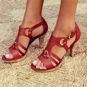 Women's red leather chunky heel strappy sandals with gold buckles, featuring a bold red color, open toe design, and elegant high heels, showcasing a fashionable and stylish appearance.