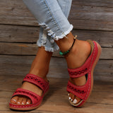 Red leather platform sandals for women, featuring a stylish design suitable for summer. The sandals have a comfortable platform sole, and they are displayed on a human foot to highlight their aesthetic and fit.