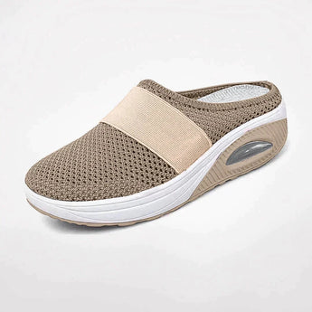 Women's red mesh slip-on sneakers with breathable material, featuring an air-cushioned sole, shown in the Cachi color variant, size 43.