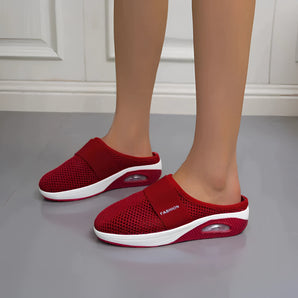 Women's red mesh slip-on sneakers with a breathable design and air-cushioned sole, shown in variant size 43.
