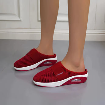 Women's red mesh slip-on sneakers with a breathable design and air-cushioned sole, shown in variant size 43.