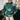 
A green XL women's Christmas sweater featuring a festive snowflake design. The knitwear is styled with long sleeves and is suitable for holiday occasions.