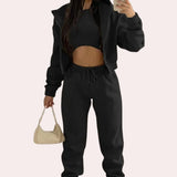 Women's XL black tracksuit featuring a cropped puffer jacket with long sleeves and a high collar, paired with drawstring joggers.
