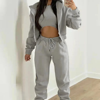 Women's gray tracksuit in size XL featuring a cropped puffer jacket with sleeves and drawstring joggers.