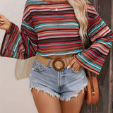 Women's retro striped knit crop top in a colorful bohemian style, featuring a red hue and designed for a 2XL size. The sweater has a distinct knit textile pattern with a focus on the shoulder and sleeve areas, and is paired with shorts.