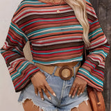 Women's colorful bohemian striped knit crop top sweater featuring long sleeves and a round neckline.