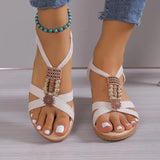 Women's Rhinestone Wedge Sandals in chic black, featuring a stylish summer design with rhinestone detailing, worn by a foot.