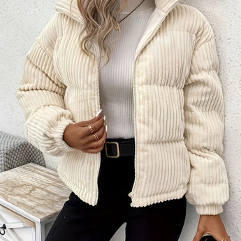 
A close-up image of a women's ribbed high collar insulated puffer jacket in beige color, size XL, featuring a stylish and cozy design with a high neckline and long sleeves.