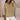 Women's sage green V-neck cable knit chunky sweater displayed on a mannequin, showcasing the detailed knit pattern with emphasis on the shoulder and sleeve design.