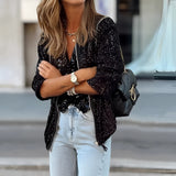 Black women's sequin blazer in size XL, showcasing a glittery street style evening jacket with a structured shoulder design, paired with stylish eyewear.