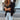 Black women's sequin blazer in size XL, showcasing a glittery street style evening jacket with a structured shoulder design, paired with stylish eyewear.