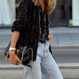 Women's sequin blazer with a glittery finish, featuring long sleeves, a tailored fit, and a single-button closure; ideal for street style evening wear.