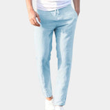Women's 3XL pastel blue skinny jeans displayed on a model, highlighting the waist, thigh, and knee areas.