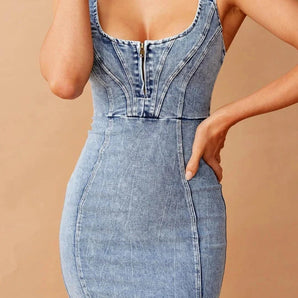 Women's sleeveless light wash denim bodycon midi dress featuring a fitted silhouette, showing details of the neck, shoulders, and waist.