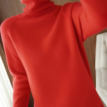 Women's red slim fit turtleneck sweater with ribbed cuffs, suitable for winter fashion, displayed on a hanger.