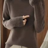 A brown 2XL women's slim fit turtleneck sweater with ribbed cuffs, highlighted in a winter fashion style. The sweater features a high collar and long sleeves, providing a cozy and chic look for the colder seasons.