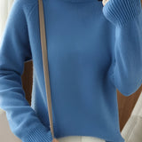 Women's slim fit blue turtleneck sweater with ribbed cuffs, featuring long sleeves and a high collar, designed for winter fashion. The sweater is displayed in blue color, size 2XL, highlighting its sleek and stylish fit.