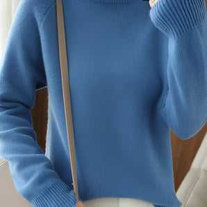 Women's slim fit blue turtleneck sweater with ribbed cuffs, featuring long sleeves and a high collar, designed for winter fashion. The sweater is displayed in blue color, size 2XL, highlighting its sleek and stylish fit.