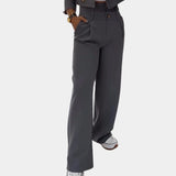 Women's slim fit gray business suit featuring high-waisted trousers and a tailored jacket, suitable for modern office wear.
