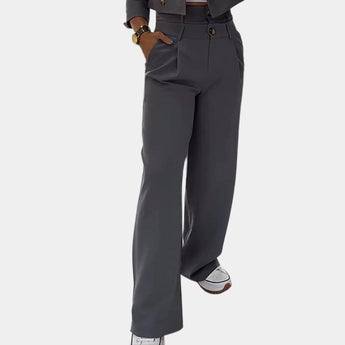 Women's slim fit gray business suit featuring high-waisted trousers and a tailored jacket, suitable for modern office wear.