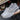 Gray women's slip-on walking sneakers featuring a lightweight and breathable design with arch support, suitable for outdoor activities and athletic wear.