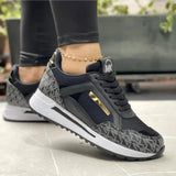 Women's trendy casual chic sneakers in dark gray with gold accents, designed for comfort and style, suitable for walking and outdoor activities.