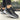Women's trendy casual chic sneakers in dark gray with gold accents, designed for comfort and style, suitable for walking and outdoor activities.