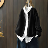 Women's black knit cardigan sweater in 3XL size, featuring long sleeves and a collar, hanging on a clothes hanger.