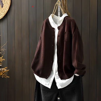 Brown women's soft knit cardigan sweater in size 3XL hanging on a clothes hanger, showcasing the full sleeves and collar design with a formal and elegant appearance.