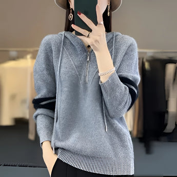 
A woman wearing a blue 2XL soft half-zip sweater with glasses. Her arm and shoulder are visible, showcasing the modern winter fashion design. The sweater features a long sleeve and a comfortable fit, suitable for stylish winter wear.