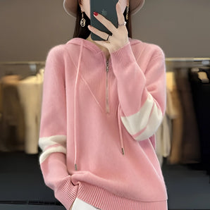 Women's soft pink half-zip sweater in a 2XL size, showcasing a chic modern winter fashion style with a prominent collar and full sleeves. The sweater's design complements the wearer's neck and waist, creating an elegant silhouette.