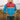 Women's striped color block puffer bomber jacket in azure, featuring a standing collar and long sleeves, worn by a smiling individual standing outdoors.