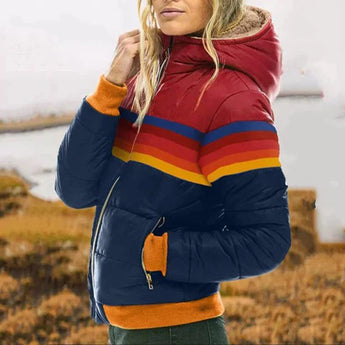 Women's orange striped color block puffer bomber jacket with long sleeves, shown on a happy person outdoors.