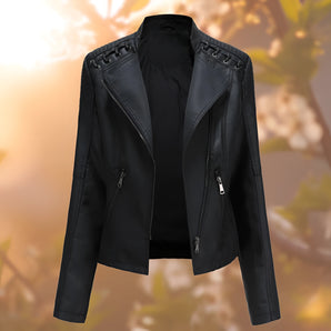 
A women's stylish black leather jacket featuring epaulettes and a front zipper, designed for fashion-forward outerwear. The jacket has long sleeves, a structured collar, and is modeled in a Nero color in size 4XL.