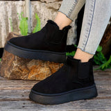 White platform high-top slip-on sneakers for women displayed outdoors, showcasing a stylish fashion design.