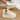 Women's stylish white platform high-top slip-on sneakers on a grey floor surface.