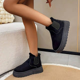 Women's stylish white platform high-top slip-on sneakers on a person's feet, featuring a sleek design with a contrasting black accent, ideal for fashionable casual wear.