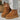Brown slip-on high-top sneakers with a platform sole, featuring a textile upper and designed for outdoor use.