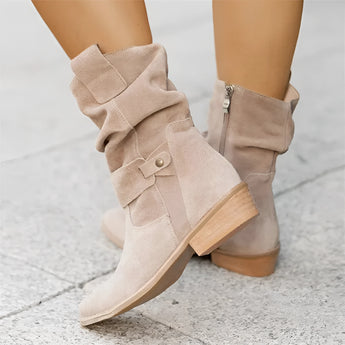 Women's apricot suede ankle boots with a buckle strap and zipper, featuring a low heel design.