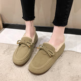 
Green women's suede fur-lined loafers with a warm, cozy design and a decorative bow on top, styled for comfort.
