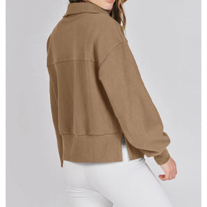 Women's tan cropped jacket featuring a stylish lightweight design, with a focus on the shoulder, neck, sleeve, and collar details, suitable for a fashionable fall fit.