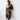 Women's tan double-breasted shearling trench coat in size XL, featuring a classic overcoat design with a notched collar, long sleeves, and a fitted waist. The coat falls to knee length, showcasing a stylish and fashionable design suitable for colder weather.