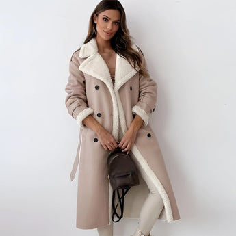Women's tan double-breasted shearling trench coat in beige, size XL, showing the full-length design with details on the collar, waist, and long sleeves.
