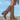 Women's tan fringe suede boots with a western boho style, shown in a mid-calf length. The boots are brown in color and photographed in an outdoor setting.